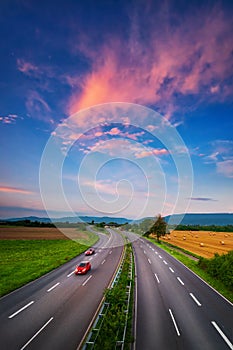 Wide road under the colorful sky