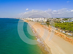 Wide sandy beach in touristic Quarteira and Vilamoura, Algarve,