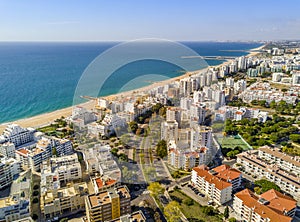 Wide sandy beach in touristic Quarteira and Vilamoura, Algarve,