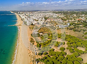 Wide sandy beach in touristic Quarteira and Vilamoura, Algarve,