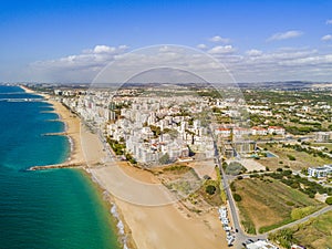 Wide sandy beach in touristic Quarteira and Vilamoura, Algarve,