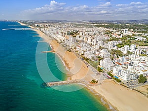 Wide sandy beach in touristic Quarteira and Vilamoura, Algarve,