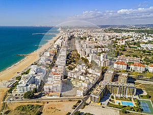 Wide sandy beach in touristic Quarteira and Vilamoura, Algarve, photo