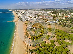 Wide sandy beach in touristic Quarteira and Vilamoura, Algarve, photo