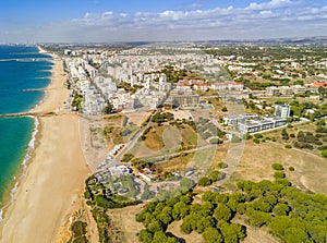 Wide sandy beach in touristic Quarteira and Vilamoura, Algarve, photo