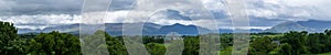 Wide scenic panorama of the Magnetron Mountain Group in Killarney National Park with the mountain tops in the clouds
