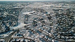 Wide shot of drone panoramic aerial view of a winter Naperville IL, city with a private sector