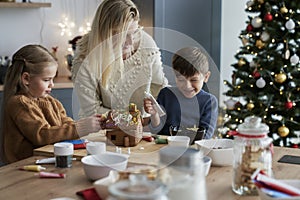 Wide shot of family spending Christmas time on baking