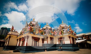 A wide shot of a hindu temple with cravings