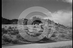 Wide shot of men on horseback in the wild west