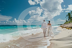 Wide shot of newly wed couple walking on the sandy tropical beach