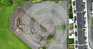 Wide shot of the schoolyard, basketball court, school roof. A bird's eye view 4k