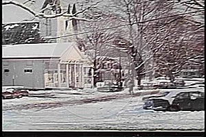 Wide shot of snowy day in small town