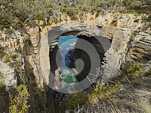 Wide shot of tasman arch at eaglehawk neck in tasmania