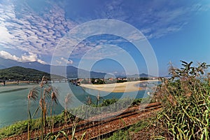 Wide shot view of Lang Ko, railway in foreground, surroundings of Ocean Clouds Hai Vanpass