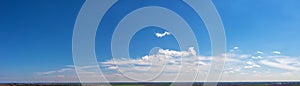 Wide sky panorama with scattered cumulus clouds