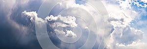 Wide sky panorama with scattered cumulus clouds bilding up before storm