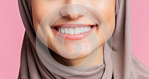 Wide smile with perfect teeth of muslim girl in hijab, closeup