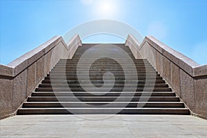 Wide stone staircase. Way up to blue sky in sunny day. Concept of hope and bright future