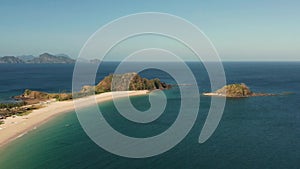 Wide tropical beach with white sand, view from above.