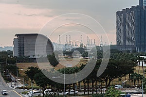 Wide urban freeway Asian metropolis. Modern buildings and structures. Singapore. Highway in dense rainforest