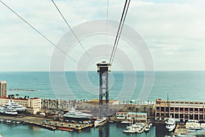 Wide view of cableway, bay and sea in Barcelona