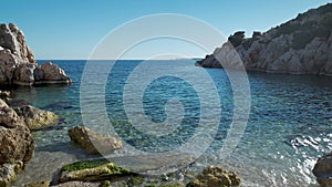 wide view of clear turcuoise water of mediterranean sea at rocky coast in Marmaris, Turkey. Summertime, tourist season