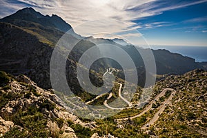 Wide view of Coll dels Reis road with mountains