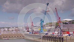 Wide view of commercial shipping port and city