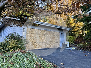 Wide view of the front of a condemned house after a wild fire caused smoke damage