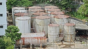 A wide view of industrial storage tanks outside the soap factory