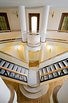 Wide view of new mansion with staircase indoors