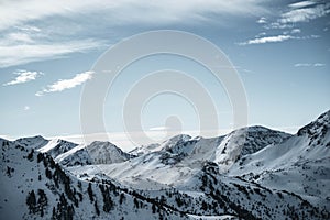 Wide view of Nocky mountains in austrian Alps. Sunny day with blue sky.