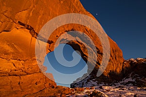 Wide view of North Window arch at sunset in Winter photo