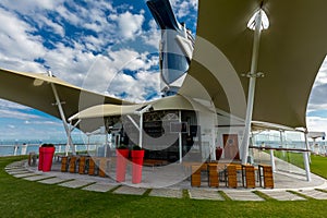 Wide View of Tall Red Pots and Real Grass Aboard Celebrity Eclipse Cruise