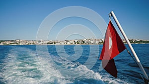 Wide wake trail from boat, back view. Deep blue water, trace from ship