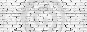 Wide white brick wall texture. Aged rough whitewashed brickwork. Grunge background