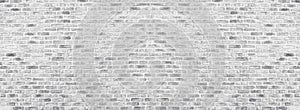 Wide white brick wall texture. Rough light gray brickwork. Whitewashed panoramic vintage background