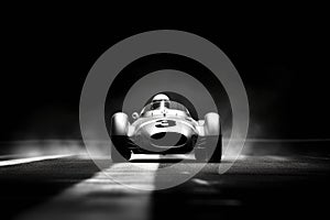 A wideangle shot of a racecar going through a chicane its tires gripping the track tightly its aerodynamics helping