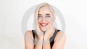 Widely smiling at camera pretty blonde photo