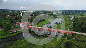 The Widest Waterfall in Europe in Latvia Kuldiga and Brick Bridge Across the River Venta Areal Dron Shot.