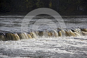 The widest waterfall in Europe in Latvia Kuldiga. River Venta. photo