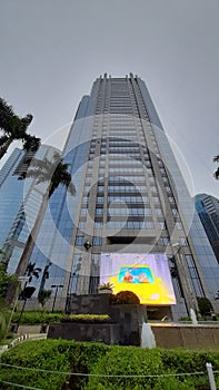 Wideview skyscrapper with Jakarta cloudy sky