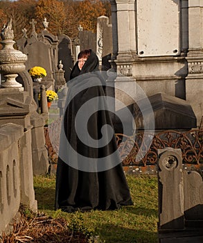 Widow in black cape