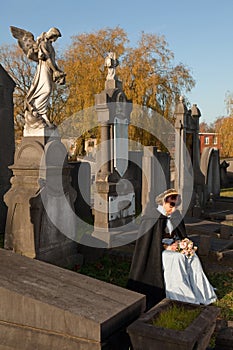 Widow in graveyard