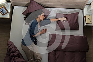 Widow lying in bed missing her husband