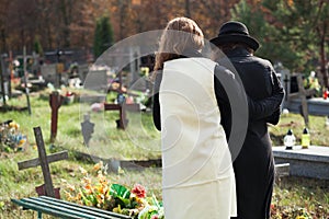 Widow supported by a friend