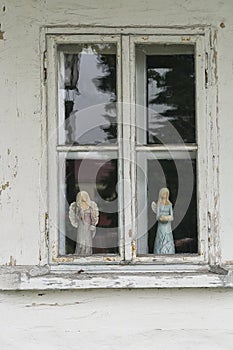 Widow in wooden building