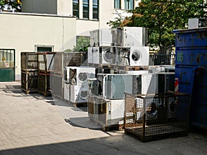 Wien/Austria - june 4 2019: discarded washing machines piled outside of a recycling and recovery compound in vienna