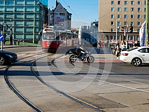 Wien/Austria - june 3 2019: An old electric tram crossing a street full of traffic at Vienna